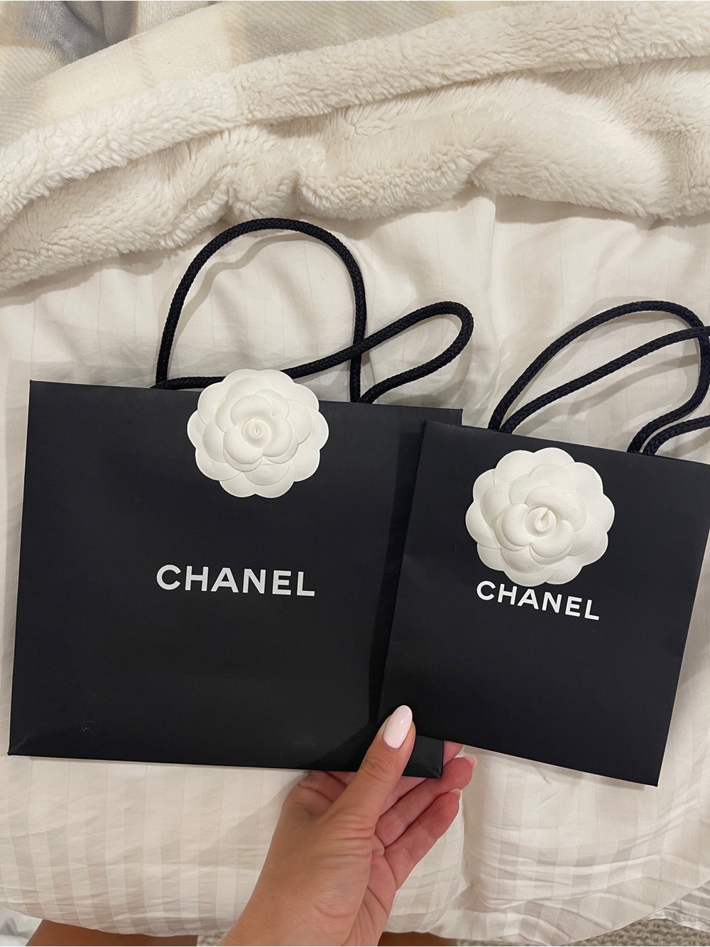 CHANEL Black Paper Shopping Bag with White Camellia Accent